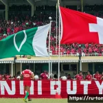 Home 20 통가에서 인기 있는 스포츠 - A vibrant rugby match in Tonga showcasing a diverse group of male and youth athletes in full sportsw...